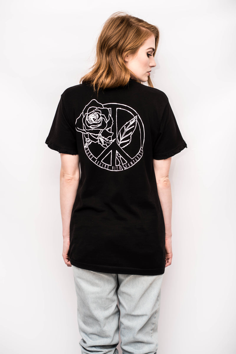 Unisex vegan hand distressed t-shirt.  Relaxed, slightly over-sized fit. Distressing at the front + back collar, edge of sleeves on both sides. Silk screened graphic in white on the front and back that reads "Peace Begins With Compassion"